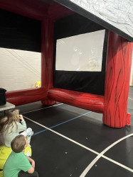 Movie20Theatre203 1713994231 Movie Screen and Bounce House